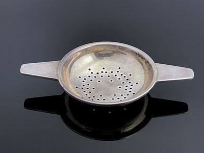 Lot 148 - A Modernist silver tea strainer, Elkington and Co, Birmingham 1960