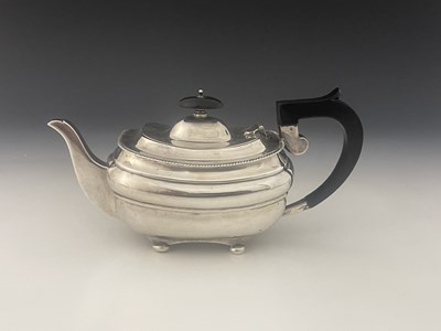 Lot 428 - A George V silver teapot, of ovoid form, with...