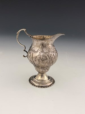 Lot 278 - A George III silver cream jug, of ogee form,...