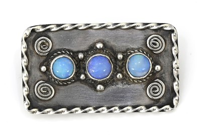 Lot 34 - An Arts and Crafts silver and opal cabochon...