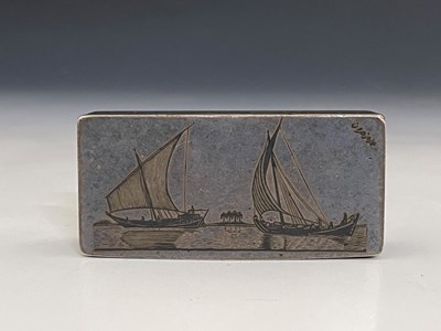 Lot 62 - A silver-coloured metal and niello snuff box,...