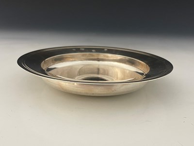 Lot 301 - An Elizabeth II silver Armada dish, the rim...