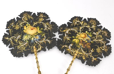 Lot 131 - A pair of Victorian papier mache face screens,...