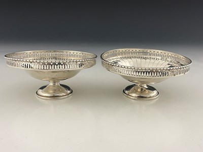 Lot 275 - A pair of George V Art Deco style silver bon...