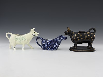 Lot 591 - Two 19th Century Jackfield cow creamers and...