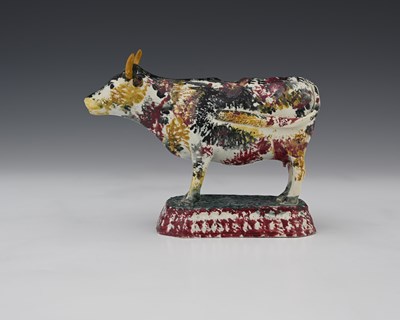 Lot 595 - An early 19th Century Yorkshire pottery cow...