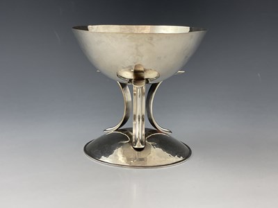 Lot 140 - An Arts and Crafts silver plated pedestal cup,...