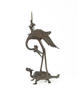 Lot 324 - A Japanese bronze figure of a stork on a...