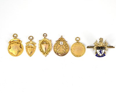 Lot 18 - Five 9ct gold medallions, including rifle...