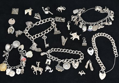 Lot 19 - Five silver charm bracelet with various charms,...