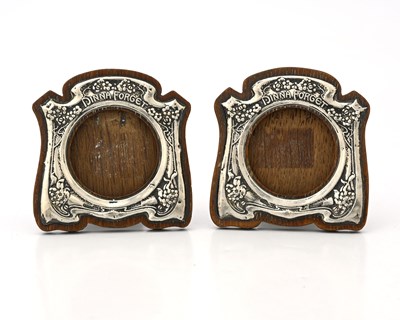 Lot 60 - A pair of Arts and Crafts silver photo frames,...