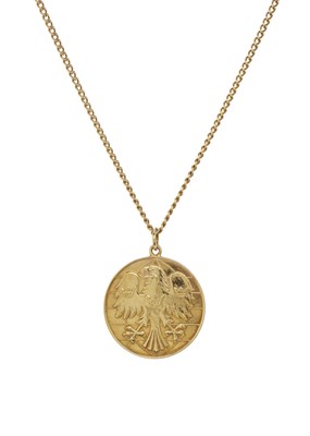 Lot 82 - An 18ct gold heraldic spread eagle medallion pendant, with chain