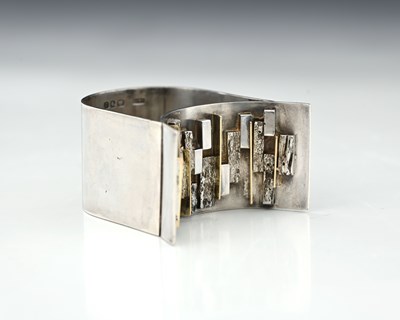 Lot 227 - A Modernist silver and parcel gilt napkin ring,...