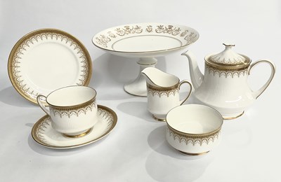 Lot 17 - A collection of gilded porcelain on a white...