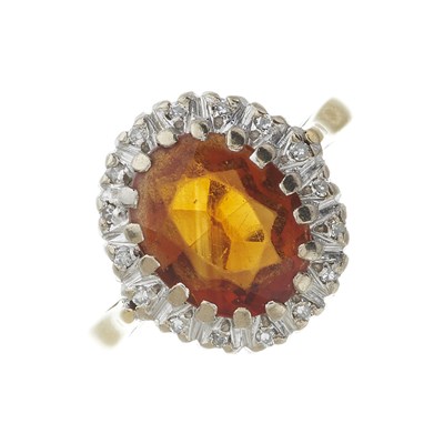 Lot 74 - An 18ct gold citrine and diamond cluster ring