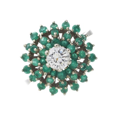 Lot 164 - An 18ct gold diamond and emerald cluster dress ring