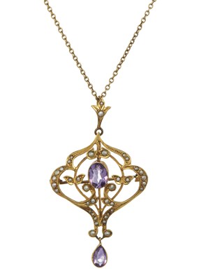 Lot 36 - An Edwardian 9ct gold amethyst and pearl openwork pendant brooch