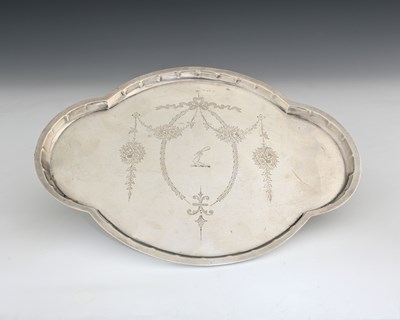 Lot 384 - A George V silver dressing table tray, of oval...