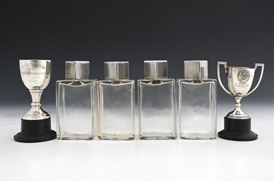 Lot 315 - A set of four Art Deco silver-topped glass...