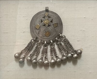 Lot 496 - An Arabian hair brooch, white metal, framed,...