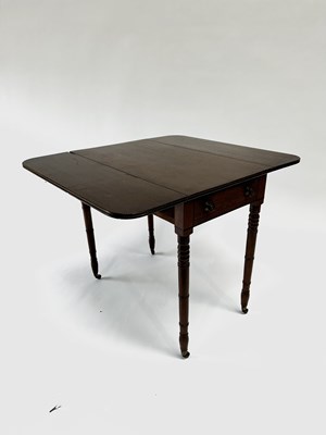 Lot 971 - A mahogany Pembroke drop-leaf table, featuring...