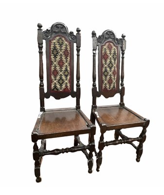 Lot 937 - A pair of Jacobean style carved oak high back...