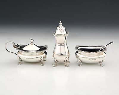 Lot 217 - A matched three-piece cruet set, comprising...