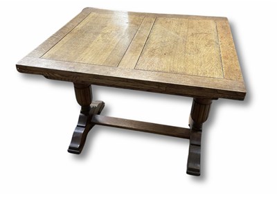 Lot 946 - An oak pullout table, measuring at 75cm high,...