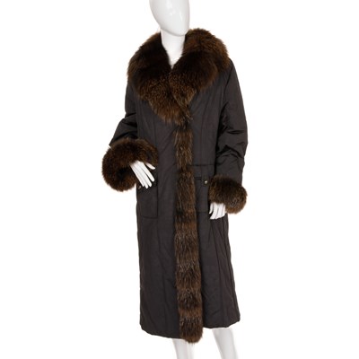 Lot 445 - A full-length black coat with fox fur trim