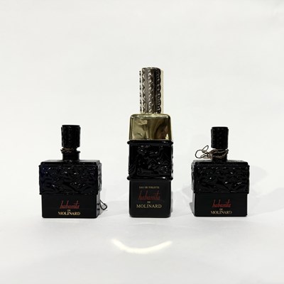 Lot 282 - Three opaque black glass Lalique perfume...