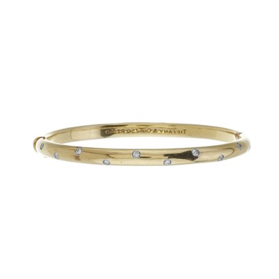 Lot 110 - Tiffany & Co., an 18ct gold diamond Etoile bangle bracelet