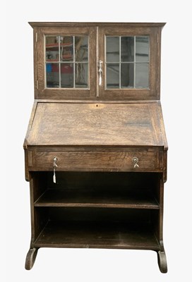 Lot 904 - An Arts and Crafts style bureau, featuring...