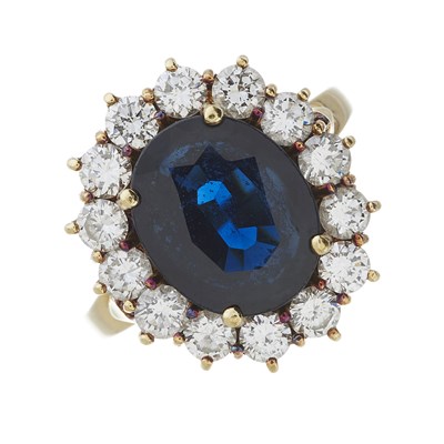 Lot 57 - An 18ct gold sapphire and diamond cluster ring