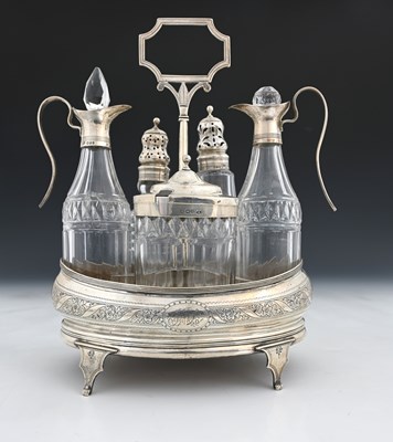 Lot 173 - A George III silver five-bottle cruet stand,...