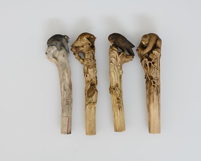 Lot 404 - Four Japanese carved bone handles, Meiji, each...