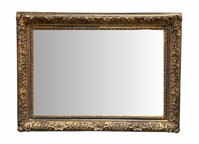 Lot 991 - An ornate gilt wood and plaster framed mirror,...