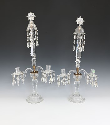 Lot 461 - A pair of George III facet cut candelabra, in...