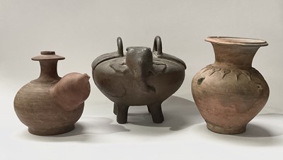 Lot 102 - A collection of terracotta vessels an inverse...