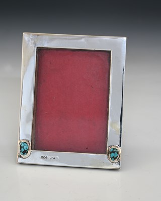 Lot 151 - Liberty & Co. An Edwardian silver-mounted...