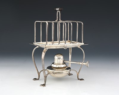 Lot 117 - Asprey. A George V silver seven bar toast rack...