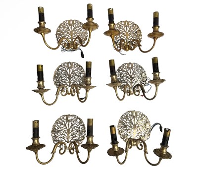 Lot 141 - Six Arts and Crafts style wall sconces in cast...