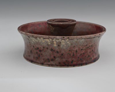 Lot 636 - Ruskin Pottery, a High Fired candle holder,...