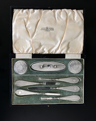 Lot 78 - A George V silver cased manicure set,...