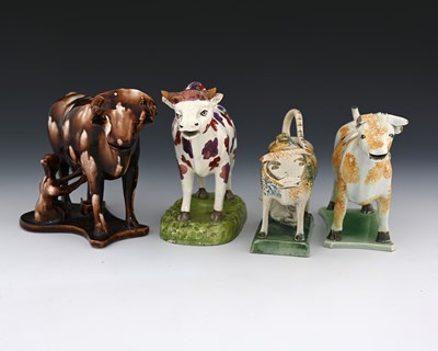 Lot 746 - Four 19th century pottery cow creamers,...