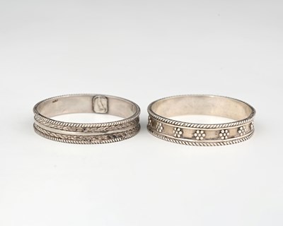 Lot 154 - H G Murphy, two Arts and Crafts silver napkin...