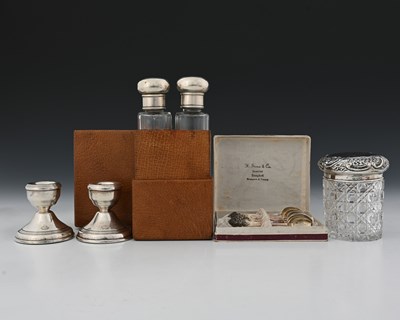 Lot 104 - A cased pair of Edwardian silver-topped toilet...