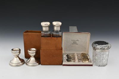 Lot 104 - A cased pair of Edwardian silver-topped toilet...