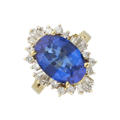 Lot 192 - An 18ct gold tanzanite and diamond cluster ring