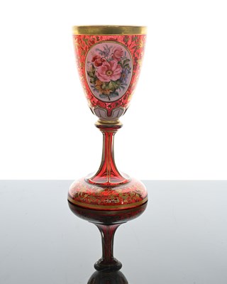 Lot 484 - A Bohemian floral plaque red glass goblet vase,...