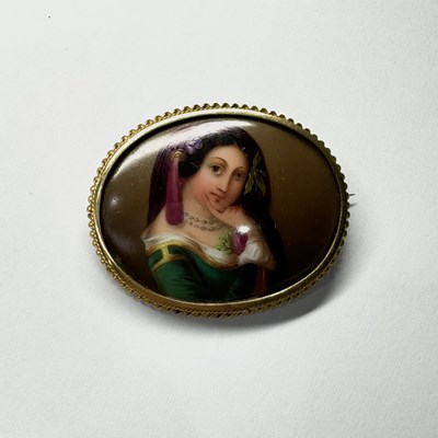 Lot 643 - A Victorian porcelain brooch mounted in yellow...